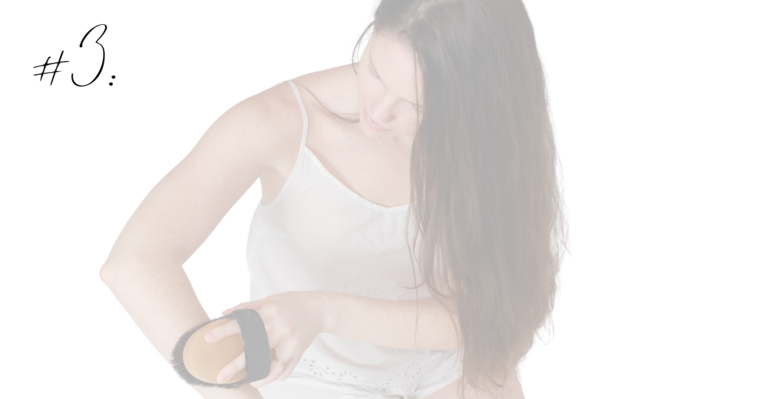 a woman dry brushing her arm