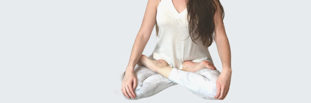 woman sitting in a yoga pose